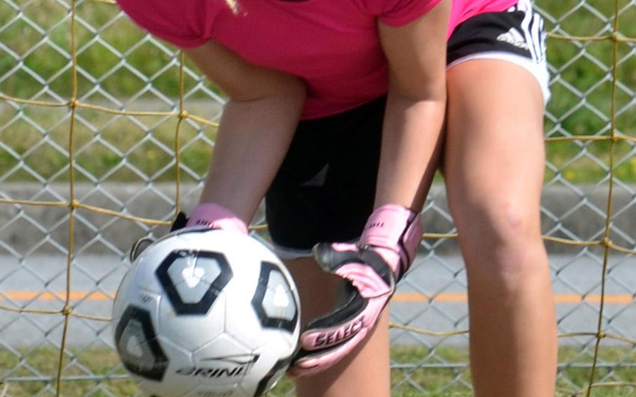 Junior goalkeeper Harleigh Lewis backstops a Kubasaki Dragons girls soccer team looking for its second Far East Division I Tournament title in three years, and may have to go through its premier rival, reigning champion American School In Japan, in the process.