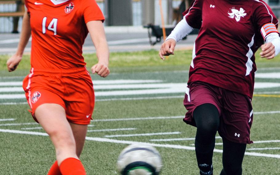 Bobbi Hill, right, a Matthew C. Perry freshman striker shown playing against Nile C. Kinnick's Charla Johnson, leads Division II girls soccer teams in goals with 10 and assists with seven.