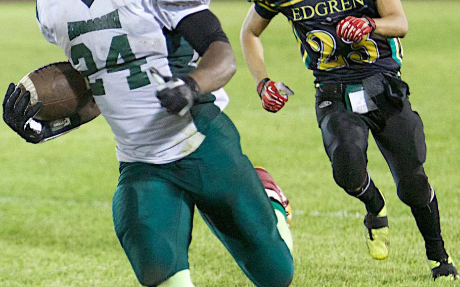 Kubasaki Dragons running back Jarrett Mitchell exits as the Okinawa single-game yardage record holder, with 379 on 14 carries in this game at Robert D. Edgren. He has won one Far East Division I championship and leaves as the school's career rushing leader in the 10-year Far East playoff era, with 3,990 yards on 357 carries.