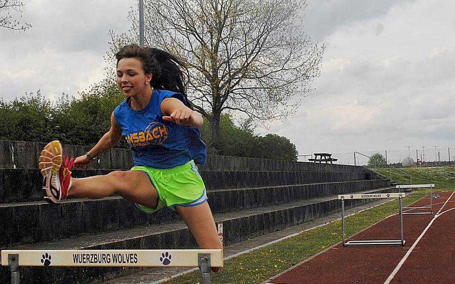 Ansbach senior Mykala Bazen clears a hurdle during a recent practice session at Ansbach. Bazen is the reigning DODDS-Europe 300-meter hurdles champion and a collegiate track and field prospect.

