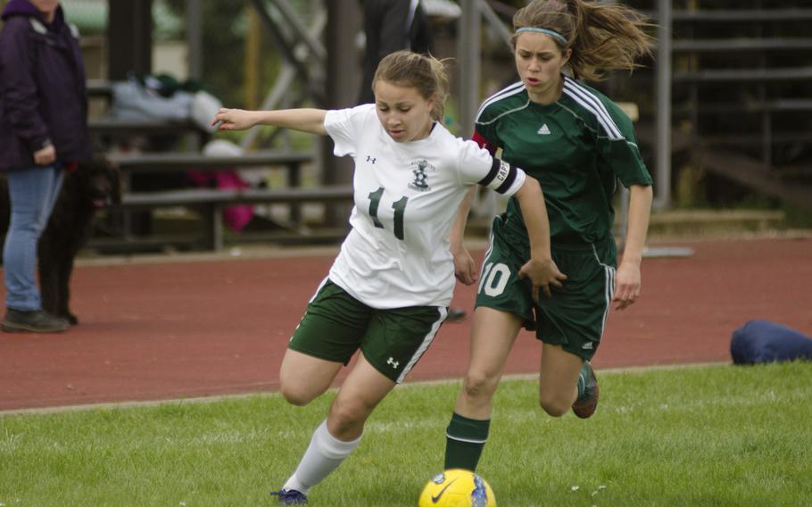 Alconbury's Samaris Batley tries to keep the ball from SHAPE's Karoline Soerenson during a soccer game at Alconbury on April 26, 2014. SHAPE won the game 6-4. The 2014 DODDS-Europe championships get underway with Division II in the Kaiserslautern area Monday, with the other divisions following Tuesday. Championship matches are set for Thursday at the Kaiserslautern High School stadium.