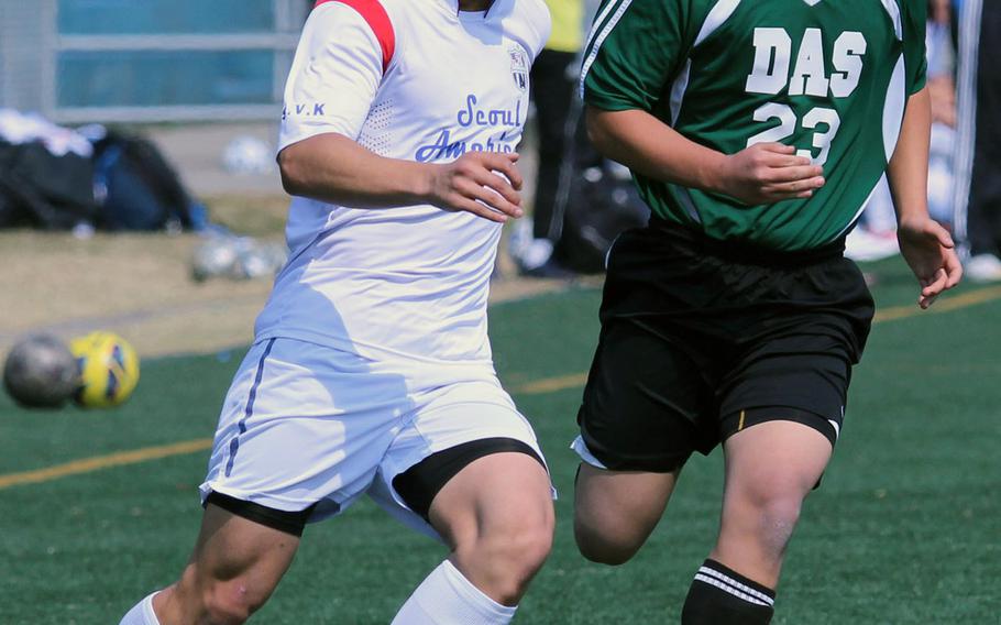 Seoul American's Jason Lee, shown playing against Daegu's Justin Pak, is one of eight seniors on the Falcons' 14-man roster going to the Far East Boys Division I Soccer Tournament at Kadena, Okinawa.