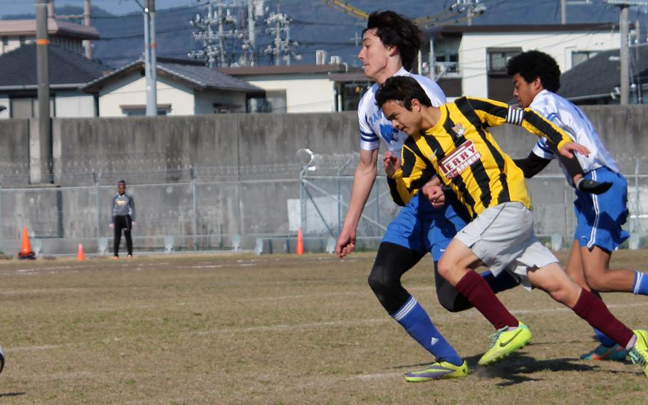 Matthew C. Perry's Calvin Barker, shown playing against Yokota's Chris Beemsterboer during a DODDS Japan soccer match, is one of five senior starters the Samurai will have at the Far East High School Boys Division II Tournament.