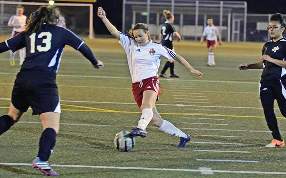 Nile C. Kinnick's Kaile Johnson, shown knifing between two Matthew C. Perry defenders, is the Pacific's leading high school girls soccer goal scorer with 35.