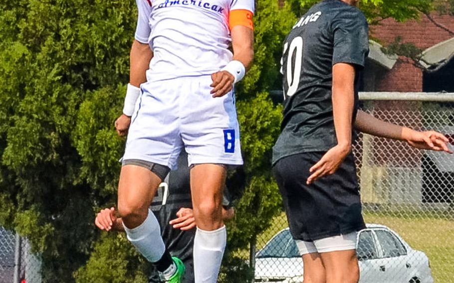 Seoul American's HoKyong Adkins, heading the ball against Seoul Foreign, leads the Falcons with 27 goals and is one of eight seniors coming to Okinawa for the Far East High School Boys Division I Soccer Tournament.