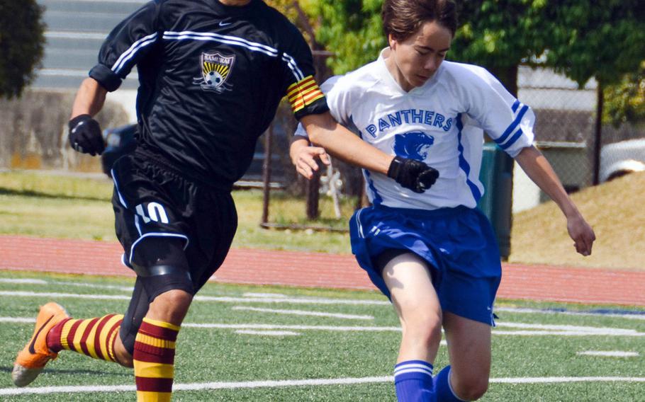 Matthew C. Perry's Gaku Lange, shown battling Yokota's Keanu McElroy during last month's DODDS Japan tournament at Camp Zama, has been the straw that stirs the Samurai's drink the last four years, tallying 138 goals and 67 assists for a team that has won the last two Far East Division II Tournament titles.