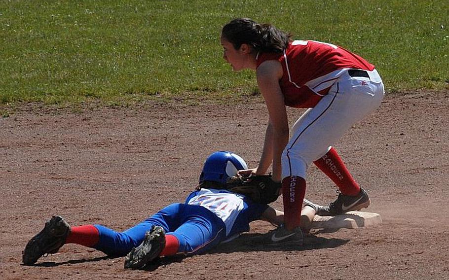 Ramstein's Bailey Loomis slides back into second base before the tag by Kaiserslautern's Megan Thornton in the Royals' 17-7 victory Friday, May 16, 2014, at Kaiserslautern, Germany. Defending champion Ramstein is expected to battle for the crown this year with nemesis Patch.
