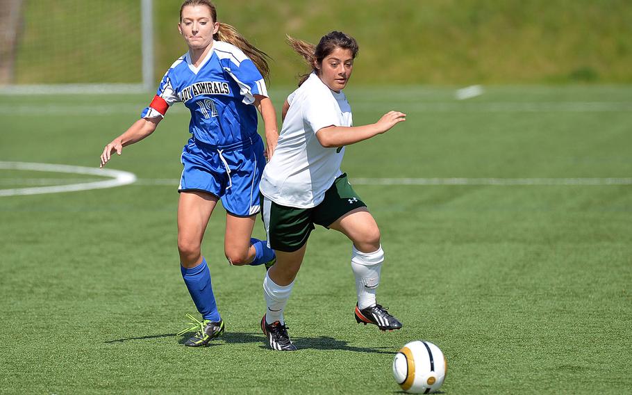 Alconbury's Roni Teti gets away from Rota's Sabrina Eierle in their opening day Division II match at the DODDS-Europe soccer championships in Landstuhl, Germany, Monday, May 19, 2014. Alconbury won 4-1