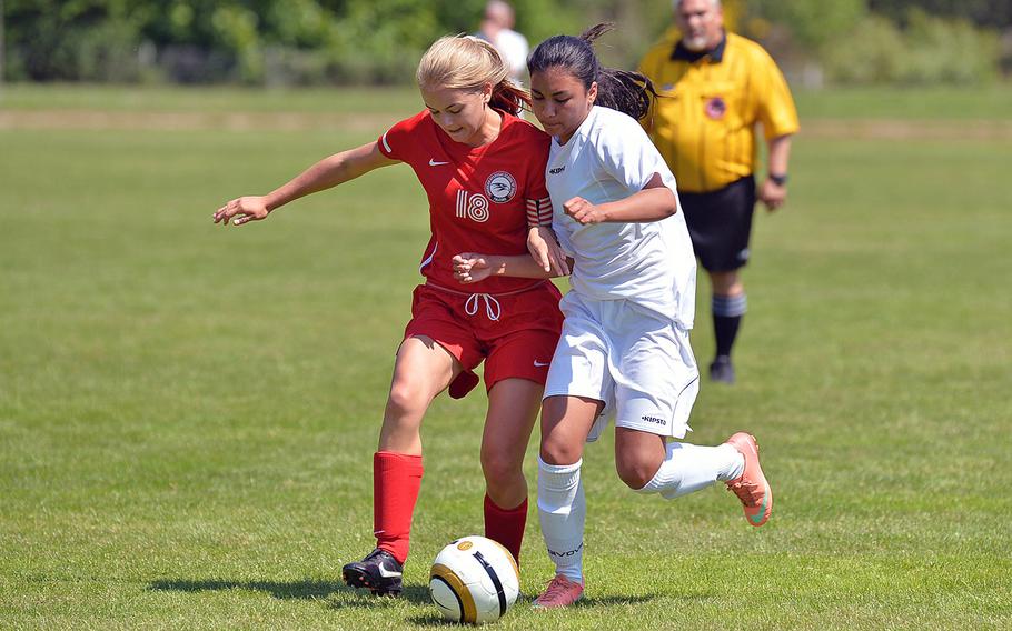 American Overseas School of Rome's Rowena Caanen, left, and SHAPE's Alina Salgado battle for a ball in their opening day Division II match at the DODDS-Europe soccer championships in Landstuhl, Germany, Monday, May 19, 2014. SHAPE won 1-0.