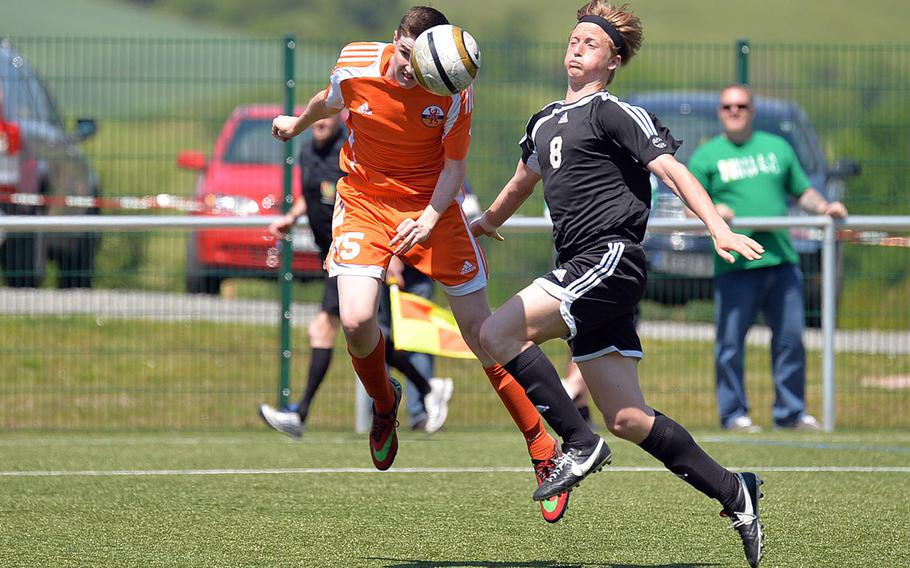 AFNORTH's Andrew Mantell heads the ball towards the goal against Vicenza's Quinn Hurt in their opening day Division II match at the DODDS-Europe soccer championships in Reichenbach, Germany, Monday, May 19, 2014. AFNORTH won 5-0.
