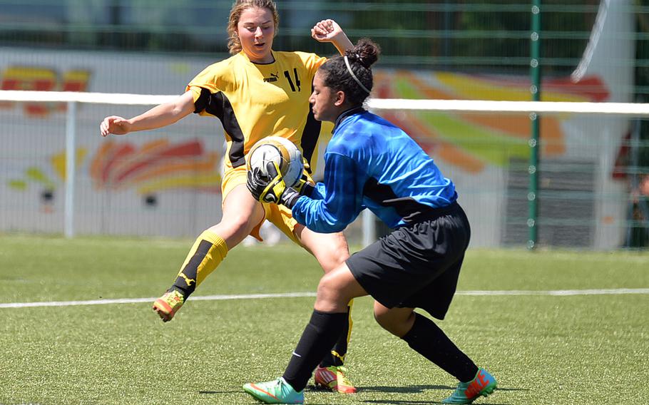 Lakenheath keeper Yesim Miller pulls in the ball before Patch's Claire Chiarotti can attempt a shot. Patch beat Lakenheath 3-0 in a Division I match at the DODDS-Europe soccer championships at Reichenbach, Germany, Tuesday, May 20, 2014.