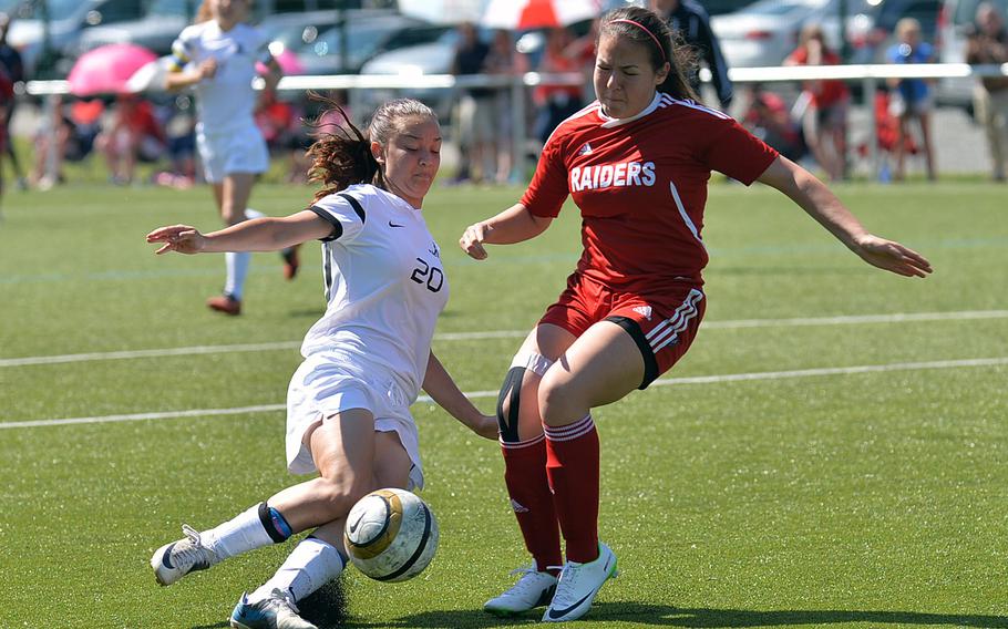 Ramstein's Danae Veloso tries to center the ball against Kaiserslautern's Jasmin Przysucha in a Division I match at the DODDS-Europe soccer championships at Reichenbach, Germany, Tuesday, May 20, 2014. Ramstein won the match 1-0.