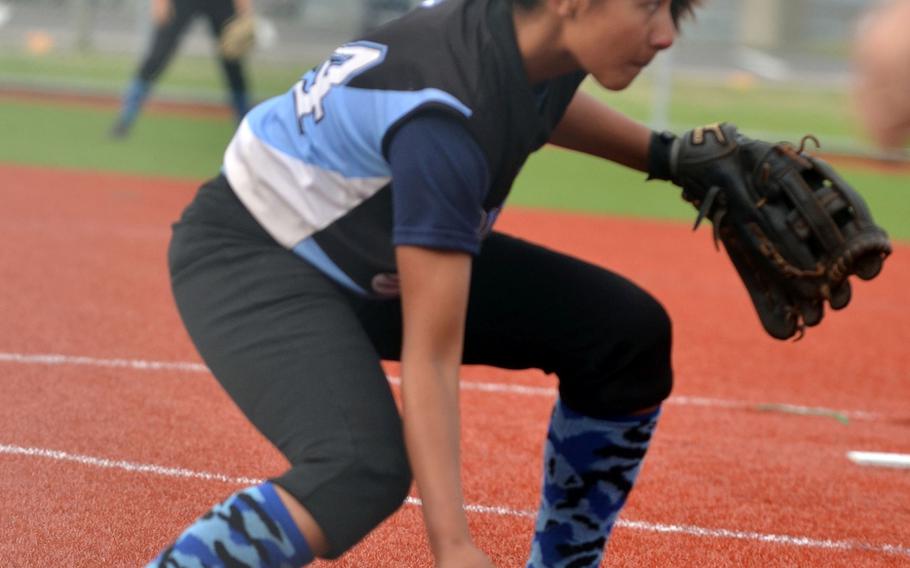 Osan American right-hander Ciera Farias readies a throw to first base against Daegu in the Far East Division II Softball Tournament final. Osan won 2-1. Farias struck out 11 and gave up two hits.