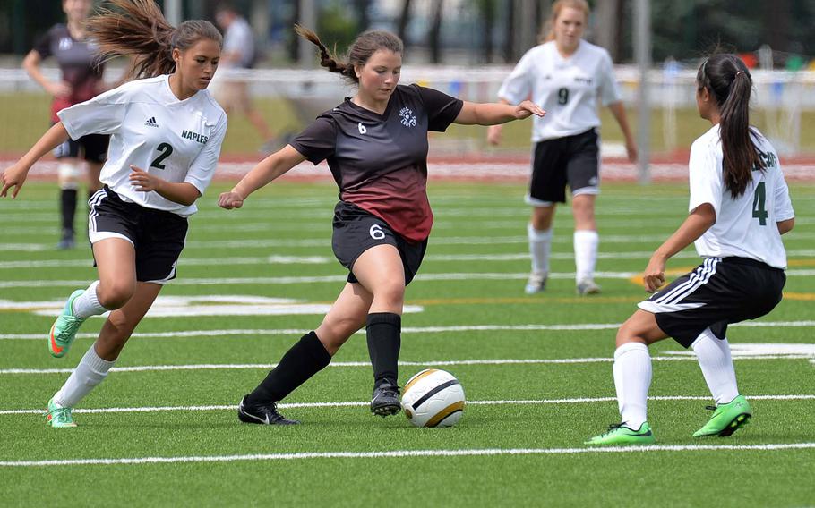 AFNORTH's Sophia Muñoz, center, takes on Jill Thurston, left, and Amanda Ortega of Naples in the Division II final at the DODDS-Europe soccer championships in Kaiserslautern, Germany, Thursday, May 22, 2014. Naples won 2-0.