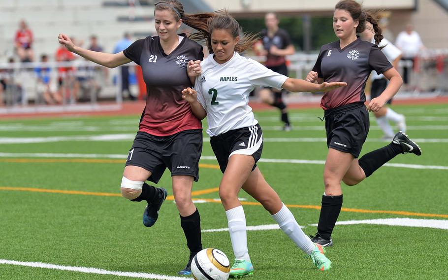 AFNORTH's Nicole Telega, left, battles with Jill Thurston of Naples as her teammate Gabriella Clark follows. Naples defeated AFNORTH 2-0 for the Division II title at the DODDS-Europe soccer championships in Kaiserslautern, Germany, Thursday, May 22, 2014