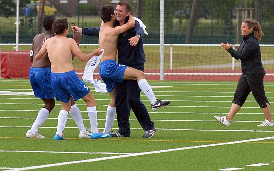 Marymount celebrates winning the Division II title at the DODDS-Europe soccer championships at Kaiserslautern, Germany, May 22, 2014, after defeating AFNORTH 2-1.