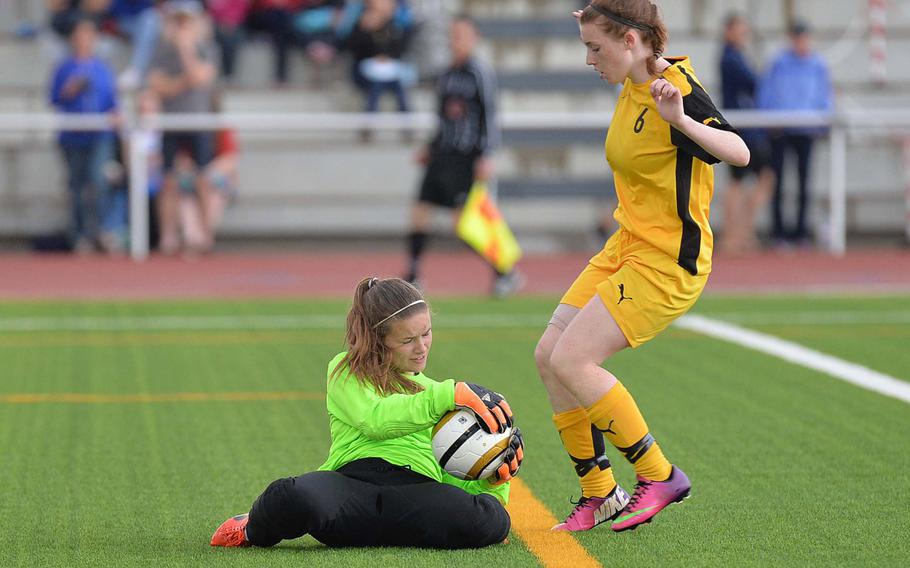Ramstein keeper Bailey Pittman pulls in the ball before Patch's Danielle Mannier can reach it in the Division I final at the DODDS-Europe soccer championships in Kaiserslautern, Germany, Thursday, May 22, 2014. Ramstein won game 1-0.