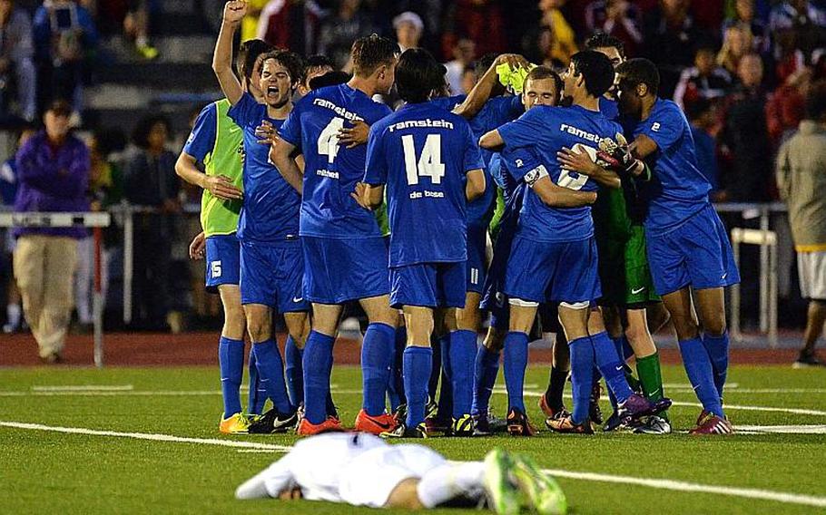 The Ramstein Royals celebrate their 4-3 win over Kaiserslautern in the Division I final at the DODDS-Europe soccer championships in Kaiserslautern, Germany, Thursday, May 22, 2014.