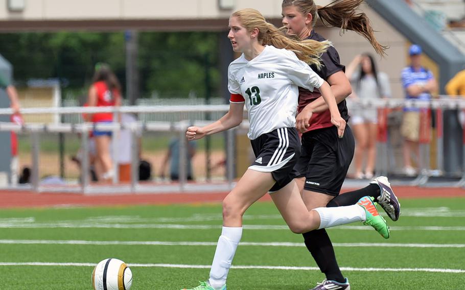 Isabella Lucy of Naples is chased by AFNORTH's Grace Phillips in the Division II final at the DODDS-Europe soccer championships in Kaiserslautern, Germany, Thursday, May 22, 2014. Naples won 2-0 to defend their title. Lucy has been selected as the Stars and Stripes Athlete of the Year for girls soccer.