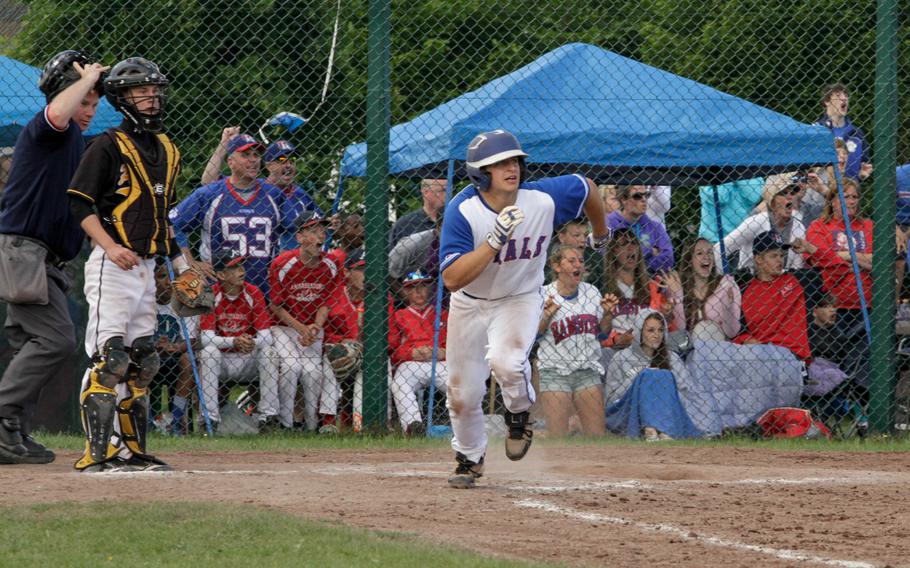 With two outs and the bases loaded in the bottom of the ninth, Ramstein's Matt Sharpy watches a well hit ball sail to the fence as he runs to first. He drove in two runs on the play, earning the Royals' a 2-1 win over the Patch Panthers in the DODDS-Europe Division I championship final.