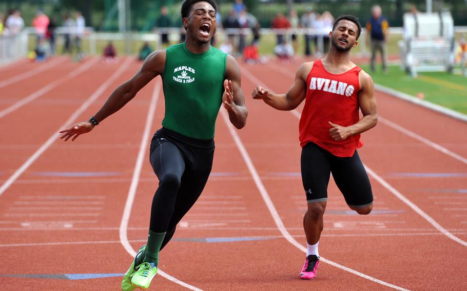 Naples' Cameron Copeland wins the boys 100-meter dash in 10.91 seconds at the DODDS-Europe track and field championships in Kaiserslautern, Germany, Saturday, May 23, 2015. Copeland also won the boys 200-meter race in 22.14 seconds.  Copeland has been named the Stars and Stripes boys Athlete of the Year for track and field.At right is Aviano's Dimitri Dawson.