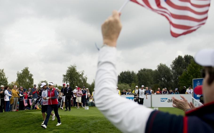 Team USA's Alison Lee smiles for cheering fans during the Solheim Cup in St. Leon-Rot, Germany, Sunday, Sept. 20, 2015. Lee defeated her opponent during the singles match.