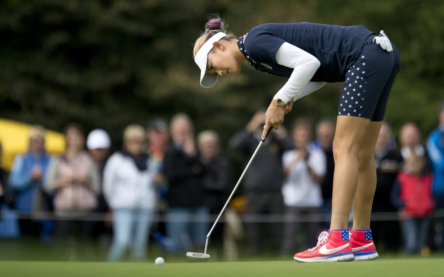 Team USA's Michelle Wie putts during the 2015 Solheim Cup, Sunday, Sept. 20, 2015, in St. Leon-Rot, Germany. Wie's 6 and 4 win against her opponent during the singles match was crucial to Team USA's comeback victory over Team Europe.