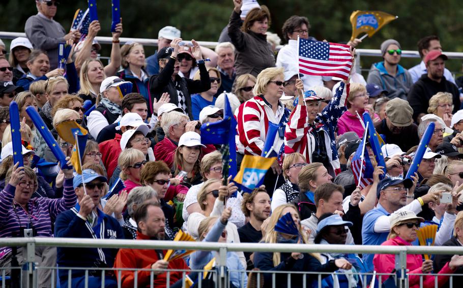 Spectators cheer during the Solheim Cup in St. Leon-Rot, Germany, Sunday, Sept. 20, 2015. Team USA defeated Team Europe, winning the cup for the first time since 2009.