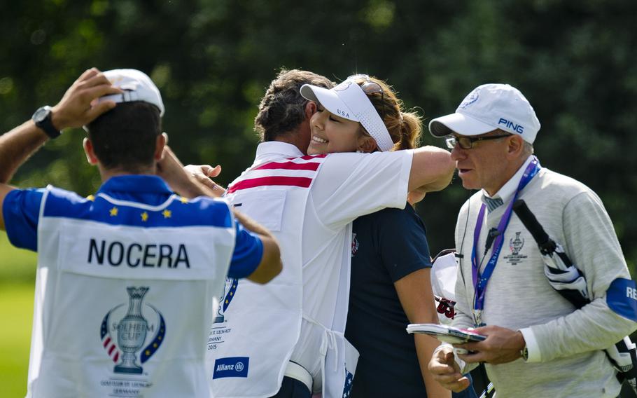Team USA's Alison Lee celebrates her win over Team Europe's Gwaldys Nocera during the Solheim Cup in St. Leon-Rot, Germany, Sunday, Sept. 20, 2015. Lee defeated Nocera 3 and 1.
