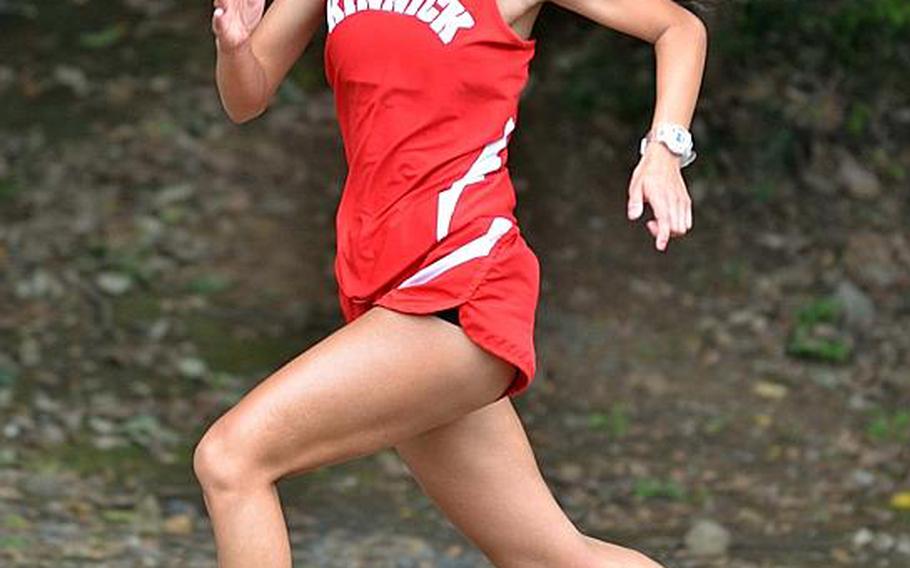 Nile C. Kinnick senior Arlene Avalos pounds for the finish in Saturday's Kanto Plain 2.1-mile girls cross-country race at Tama Hills Recreation Center. Avalos was timed in 12 minutes, 58.2 seconds, becoming just the third runner in league history to beat 13 minutes on that course.