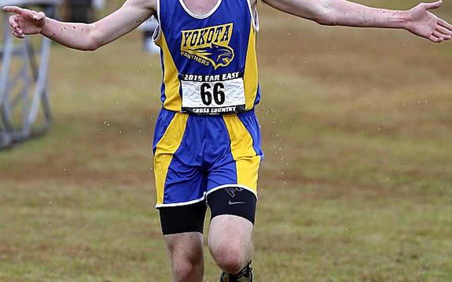 The quest ends: Yokota senior Daniel Galvin crosses the finish line in a course-record 16 minutes, 52.03 seconds, capturing his first title at a Far East High School Cross Country Meet.