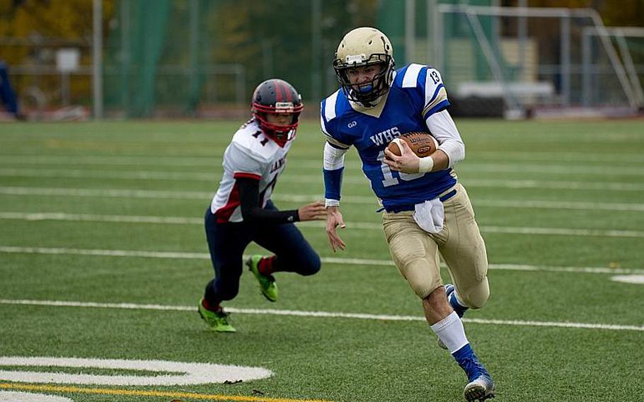 Wiesbaden Warrior Eric Arnold runs the ball during the DODDS-Europe Division I football semifinals at Wiesbaden, Germany, on Saturday, Oct. 31, 2015.