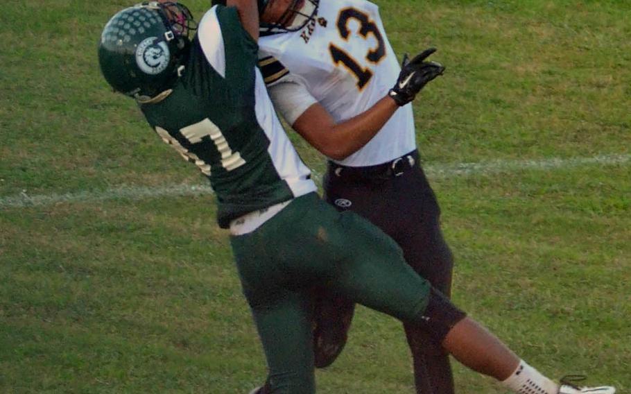 Kubasaki WR Miles Mahlock and Kadena defender Donte Savoy can't find the handle on the ball.