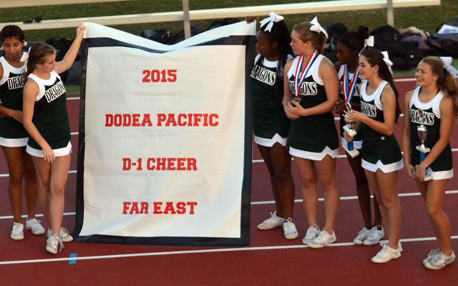 Halftime saw Kubasaki champions in other sports displaying their title wares, including Dragons cheerleading, which won its first Far East Division I banner since 2005.