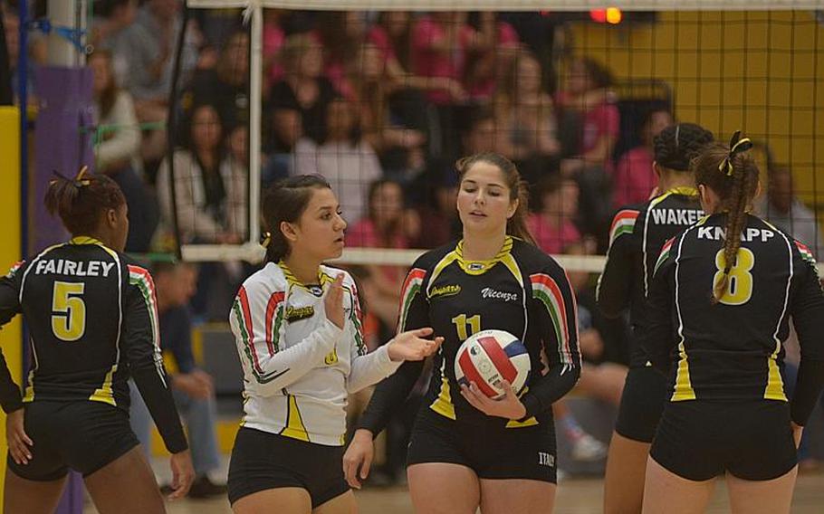 Gabriella Campos, wearing white, of Vicenza, tries to motivate her teammates during the DODDS-Europe Division I volleyball championship match against Stuttgart  at Ramstein Air Base, Germany, Saturday, Nov. 7, 2015.