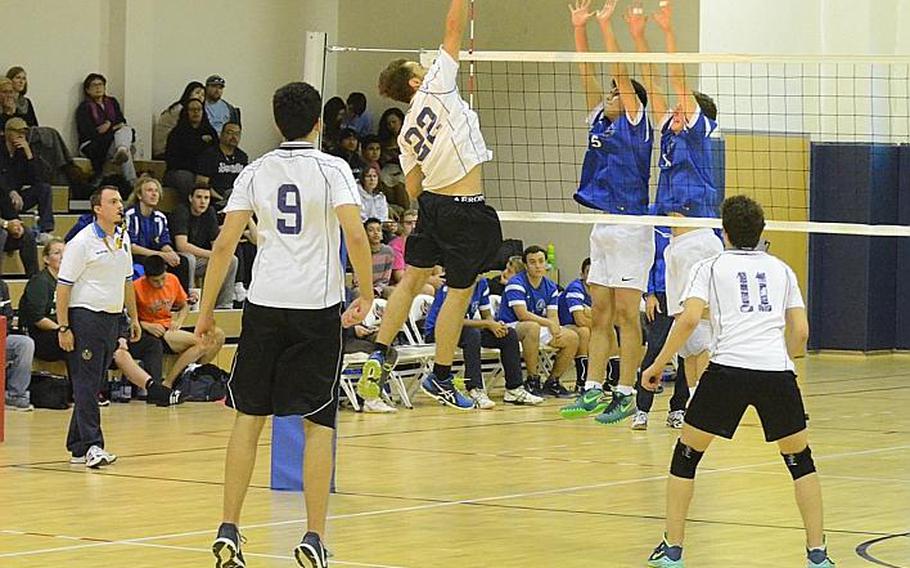 Bahrain's Jose Chianello fires a spike towards Marymount International defenders Saturday during the DODDS-Europe boys volleyball championship match at Aviano Air Base, Italy. The Falcons beat the Royals, 25-23, 25-19, 25-22.
