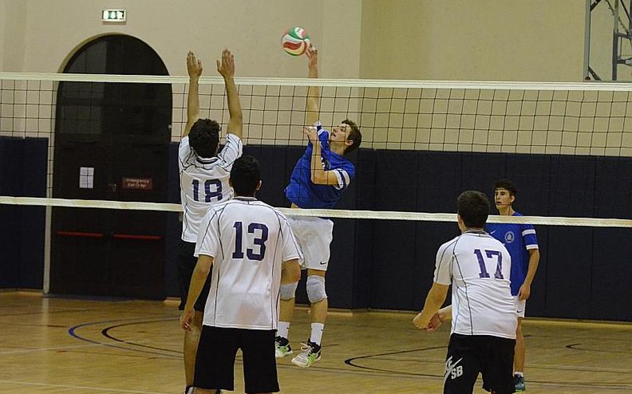 Marymount International's Giovanni Acampora spikes the ball over the net Saturday during the 2015 DODDS-Europe boys championship match at Aviano Air Base, Italy. The Falcons beat the Royals, 25-23, 25-19, 25-22.