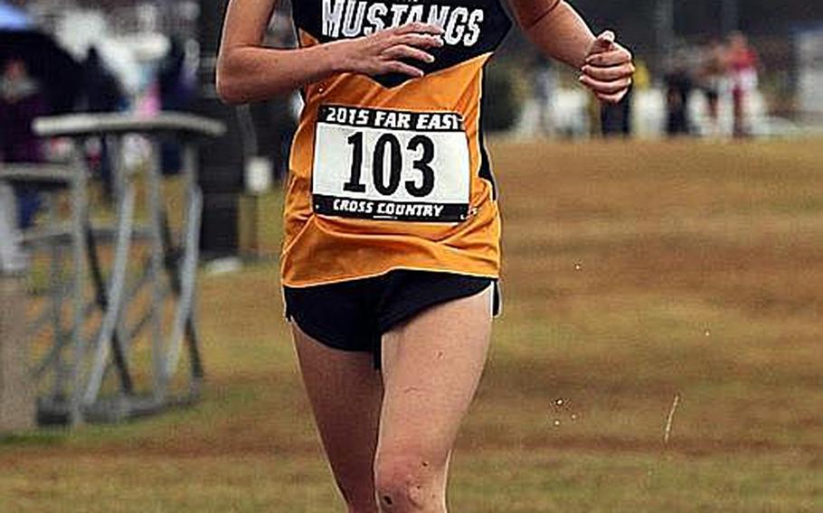 American School In Japan junior Lisa Watanuki crosses the finish line at the Far East Cross Country Championships in 20 minutes, 7.31 seconds.