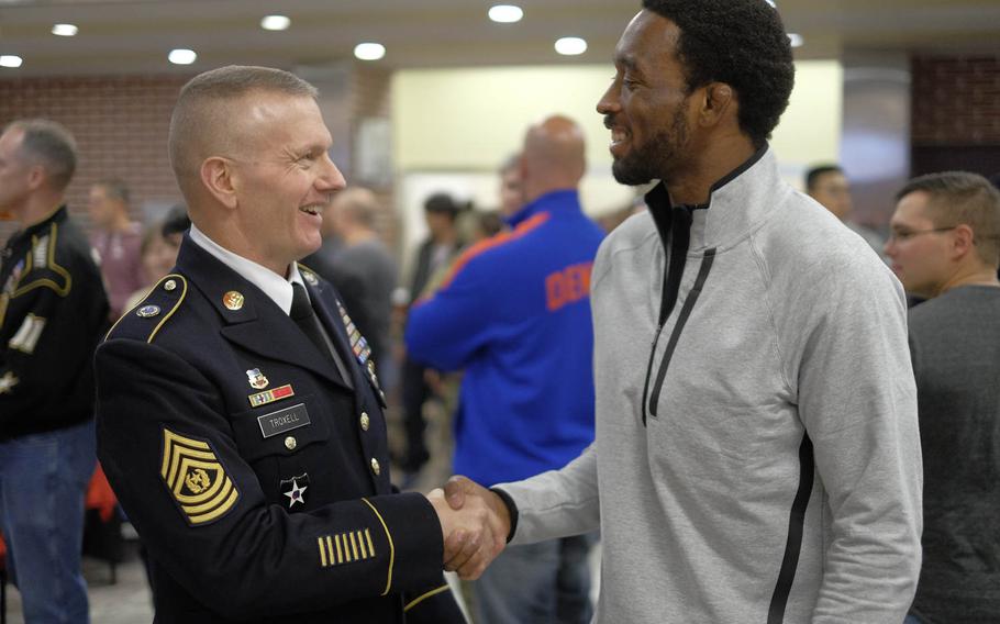Command Sgt. Major John Troxell, command sergeant major of United Nations Command/Combined Forces Command Korea, meets Ultimate Fighting Championship fighter Dominic Waters on Thursday, Nov. 26, 2015, at U.S. Army Garrison Yongsan in Seoul, South Korea. Troxell says he is a UFC fanatic and plans to be at Fight Night 79 in Seoul on Saturday.
