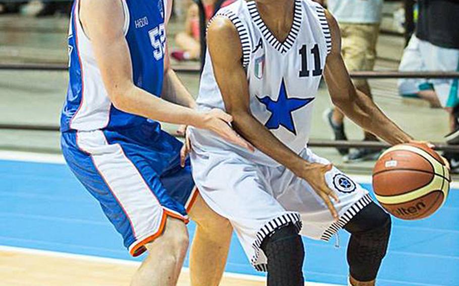 Dominic Laffitte looks to pass in a game for Italian club team Stella Azzurra. Laffitte is now a standout freshman for DODDS-Europe Division II team Marymount.