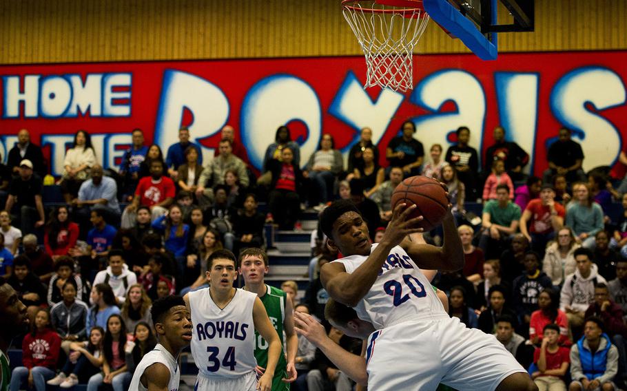 Ramstein Royal Brendan Hicks gets a rebound during the DODDS-Europe holiday tournament at Ramstein Air Base, Germany, on Monday, Dec. 21, 2015. The Royals beat the SHAPE Spartans 44-21.