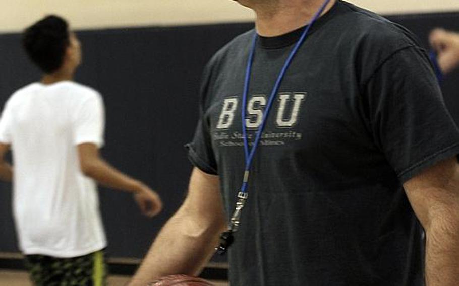 Osan boys basketball coach Morgan Nugent calls out instructions during practice.