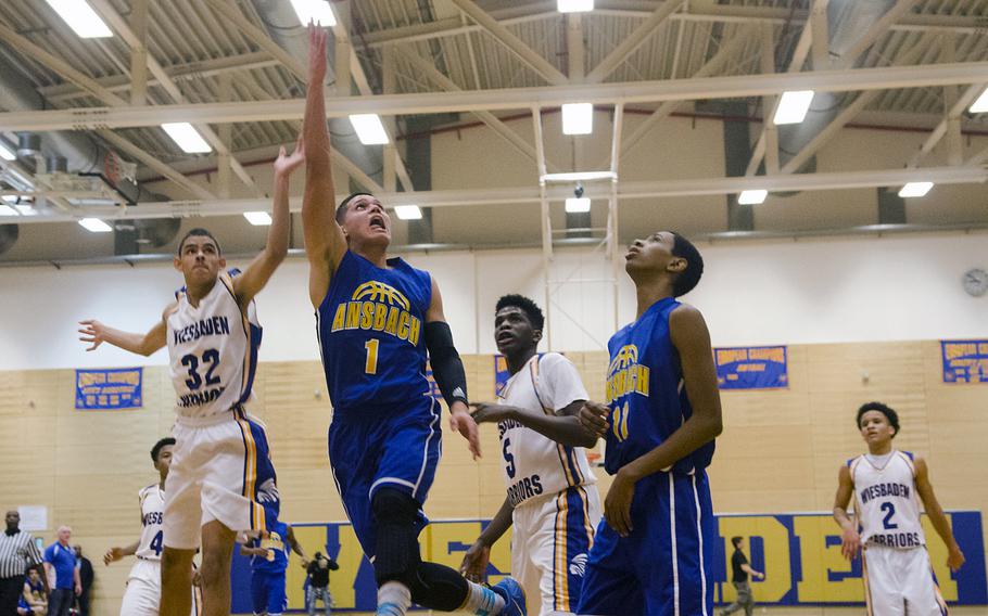 Yadiel Rodriguez of Ansbach attempts a lay-up in a boys basketball game Friday, Jan. 8, 2016 in Wiesbaden.