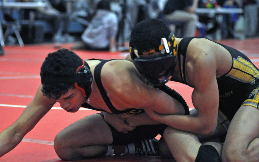 Stuttgart's man of mystery, Isaiah Phillips, got past Vilseck's Aaron Merritt on his way to a top finish at 126 pounds in the DODDS-Europe Southern Sectional on Saturday in Aviano Air Base, Italy. Phillips broke his nose recently in practice, so has to wear a protective mask.