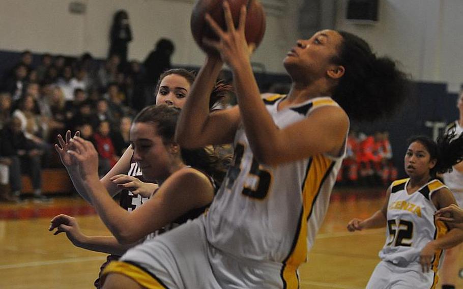 Vicenza's Aerial Rouse drives for a basket in the Cougars' 45-5 demolishing of Vilseck on Friday, Jan. 29, 2016, in Vicenza, Italy. The Cougars haven't lost this season in DODDS play.
