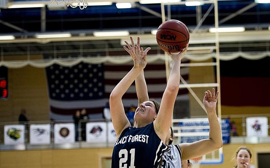 Black Forest Academy's Mia Rottier goes for a layup past Bitburg's Elise Rasmussen during the DODDS-Europe Division II championship game in Wiesbaden, Germany, Saturday, Feb. 27, 2016. Black Forest Academy beat Bitburg 25-16 to win the title.
