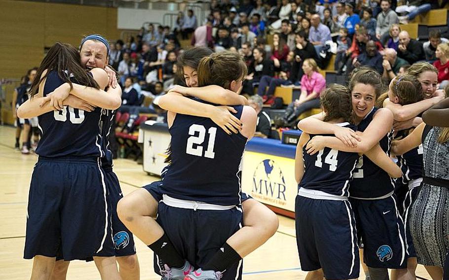 The Black Forest Academy Falcons celebrate after winning the DODDS-Europe Division II championship game in Wiesbaden, Germany, Saturday, Feb. 27, 2016. The Falcons beat the Bitburg Barons 25-16 to win the title.