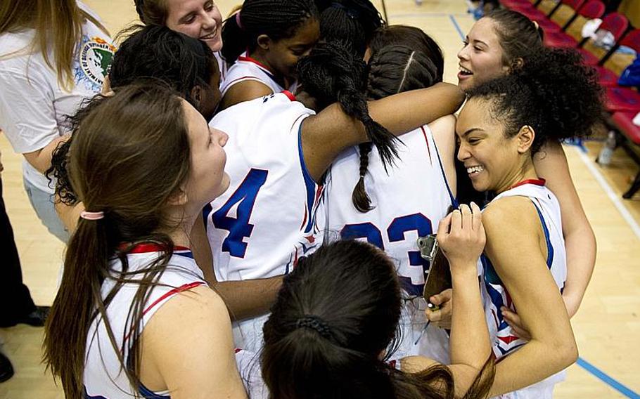 The Ramstein Royals celebrate after winning the DODDS-Europe Division I championship game in Wiesbaden, Germany, Saturday, Feb. 27, 2016. Ramstein beat the Vicenza Cougars 49-46 in overtime to win the title. 