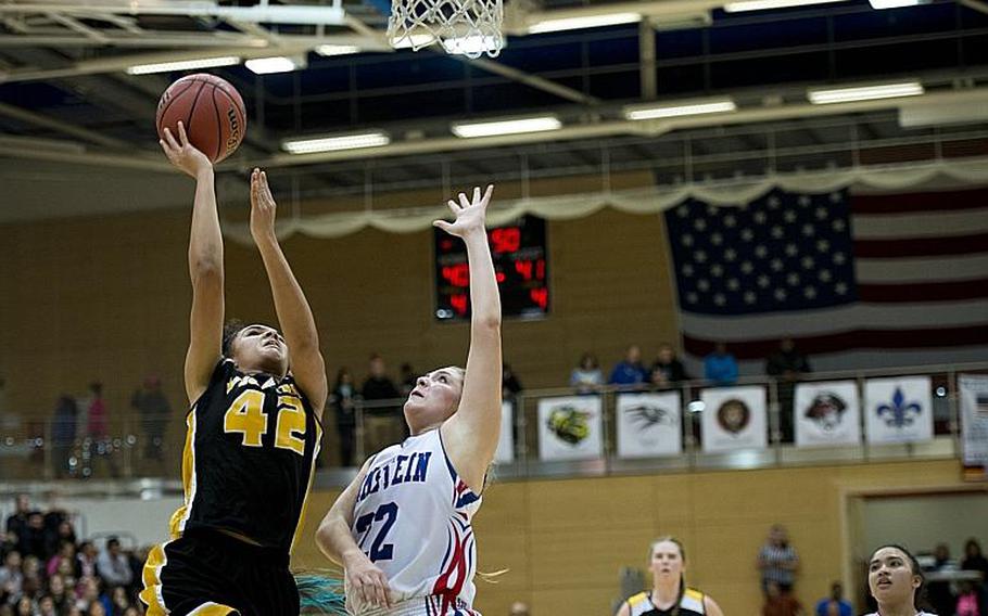 Vicenza's Jordan Wakefield goes for a layup over Ramstein's Lindsey Breton during the DODDS-Europe Division I championship game in Wiesbaden, Germany, Saturday, Feb. 27, 2016. Vicenza lost to Ramstein in overtime 49-46. 