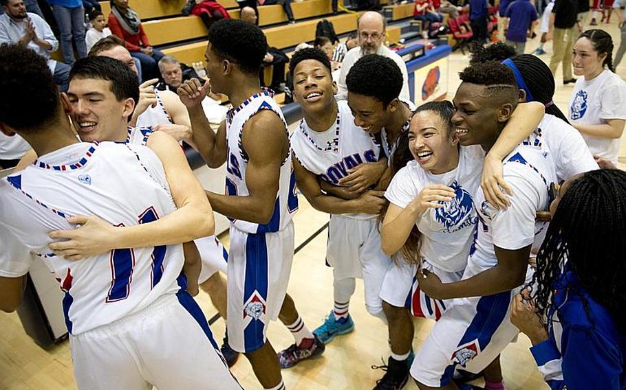 The Ramstein Royals celebrate after winning the DODDS-Europe Division I championship game in Wiesbaden, Germany, Saturday, Feb. 27, 2016. The Royals defeated the Kaiserslautern Raiders 54-46 to win the title.